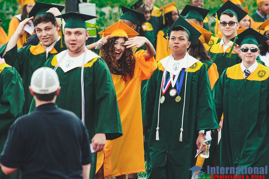 A group of diverse students holding graduation caps, symbolizing the inclusivity of UK scholarships in 2024